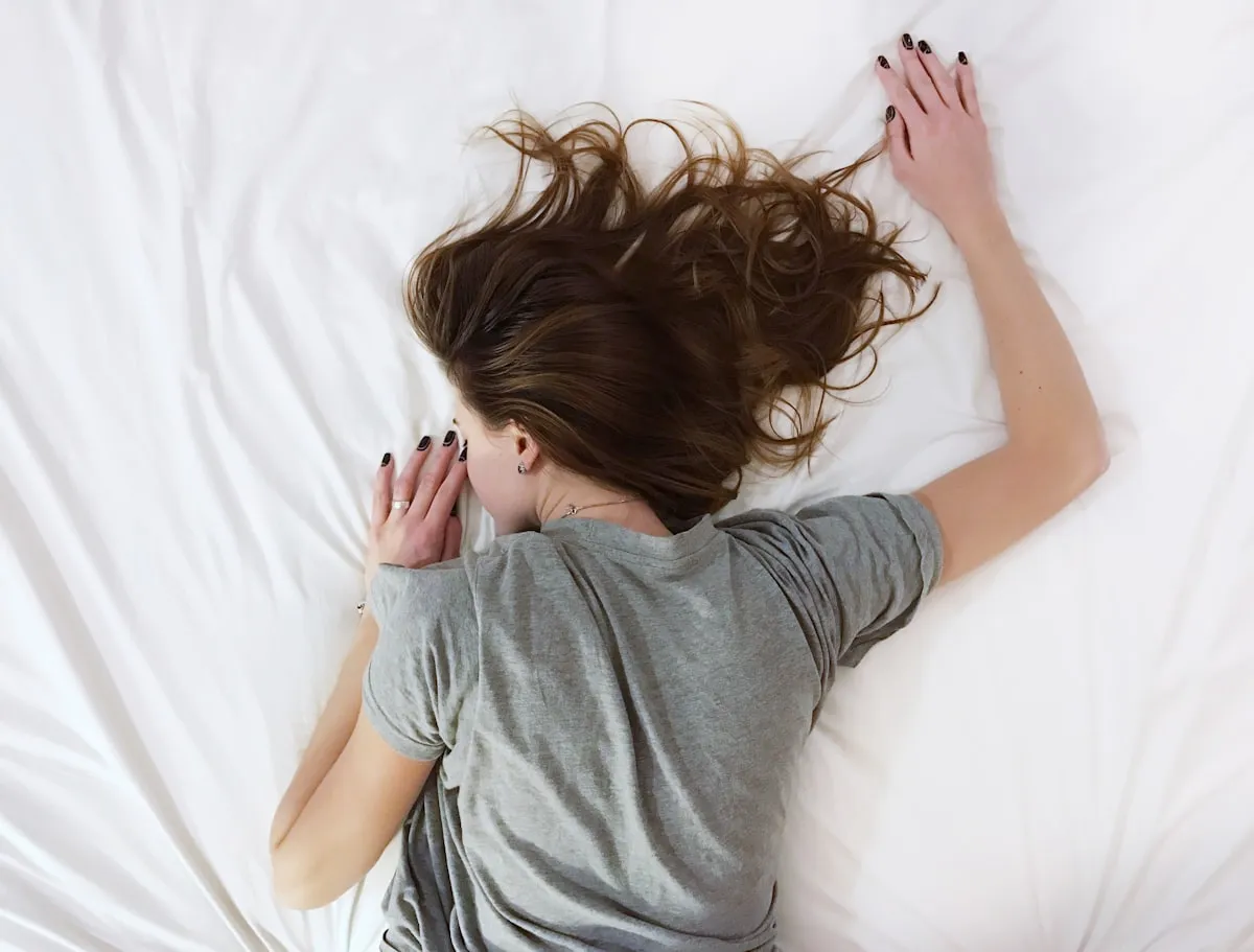 Cozy blanket and soft lighting creating a perfect sleep environment